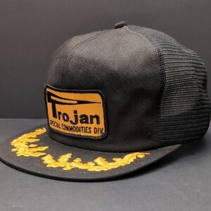Trojan Special Commodities Mens Black/Gold Mesh Snapback Trucker Hat.
